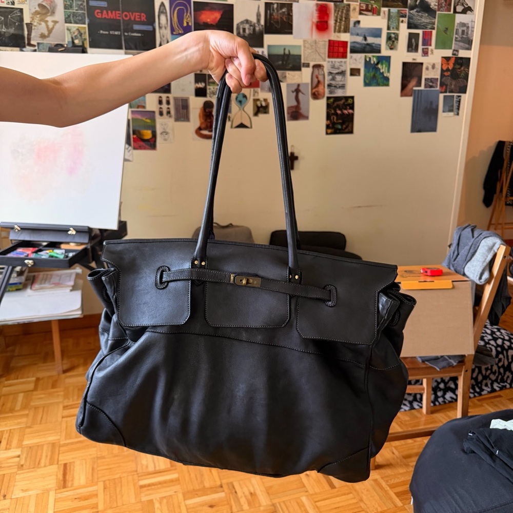 Black travel leather bag